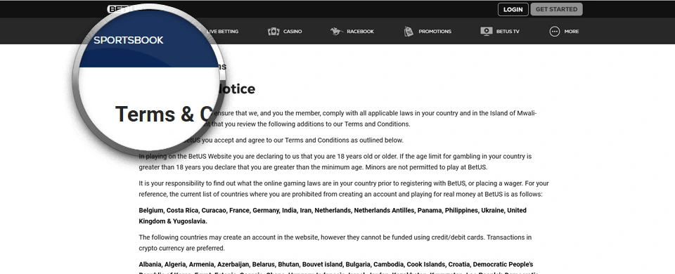 BetUS terms and conditions in greyscale with the magnifier enlarging Terms text and Sportsbook menu item